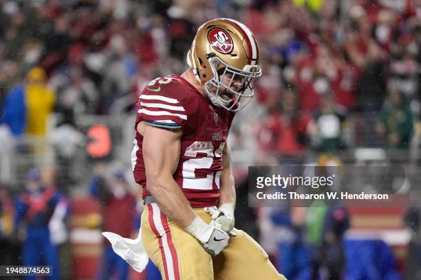 Christian McCaffrey of the San Francisco 49ers celebrates after scoring a 6-yard rushing touchdown during the fourth quarter against the Green Bay...
