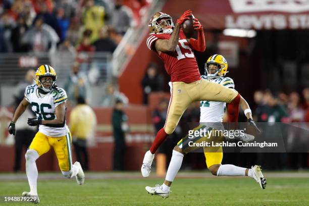 Jauan Jennings of the San Francisco 49ers catches a pass during the fourth quarter against the Green Bay Packers in the NFC Divisional Playoffs at...