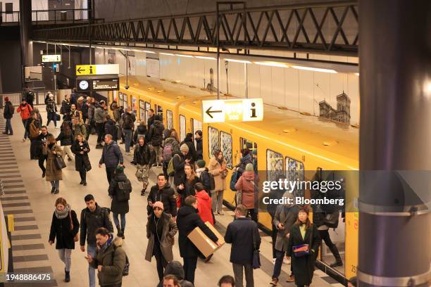 Commuters leave a U-Bahn underground train during a strike by train drivers, at the Central railway station in Berlin, Germany, on Wednesday, Jan....