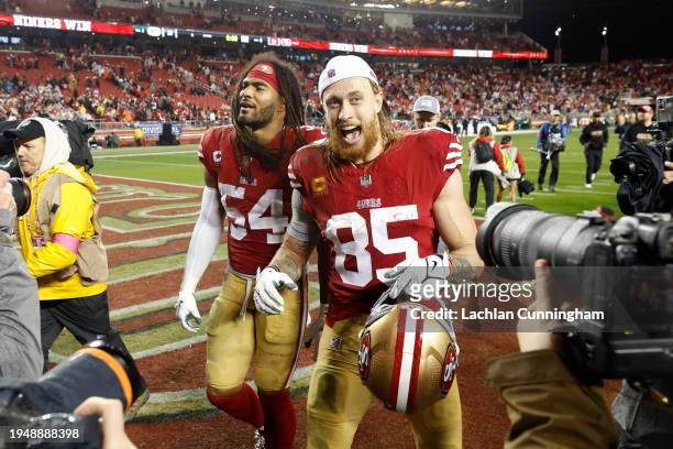 Fred Warner and George Kittle of the San Francisco 49ers leave the field after the 49ers defeated the Green Bay Packers 24-21 in the NFC Divisional...