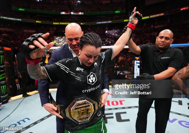 Raquel Pennington reacts after her victory against Mayra Bueno Silva of Brazil in a UFC bantamweight championship bout during the UFC 297 event at...
