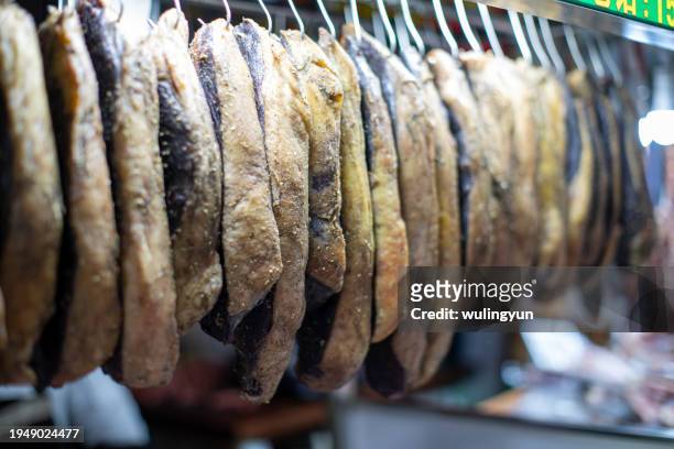 hanging beef jerky at the market stall - beef jerky stock pictures, royalty-free photos & images
