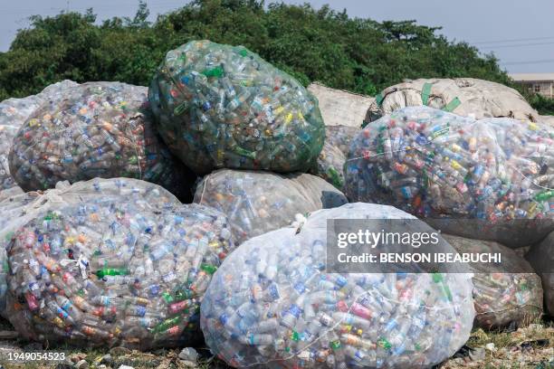 Used plastic containers stand at a dumpsite in UNILAG ready to be recycled in Lagos on January 23, 2024.