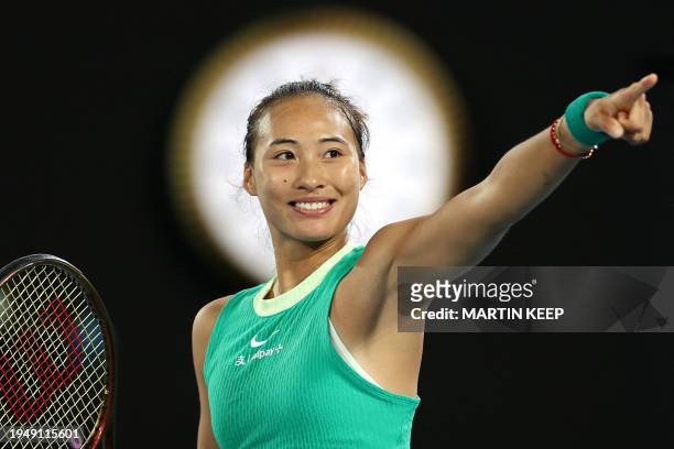 China's Zheng Qinwen celebrates victory against Russia's Anna Kalinskaya during their women's singles quarter-final match on day 11 of the Australian...