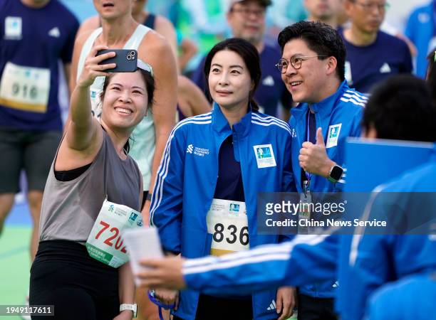 Vice President of the Fok Ying Tung Group Kenneth Fok Kai-kong and his wife Guo Jingjing pose for a photo during the Standard Chartered Hong Kong...