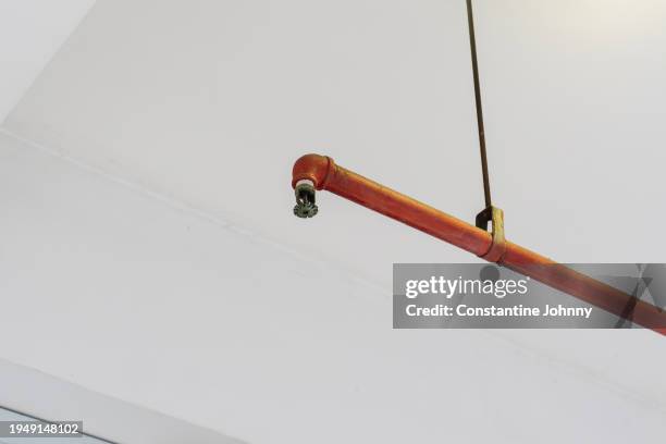 ceiling mounted fire sprinkler head - sprinkler ceiling stock pictures, royalty-free photos & images