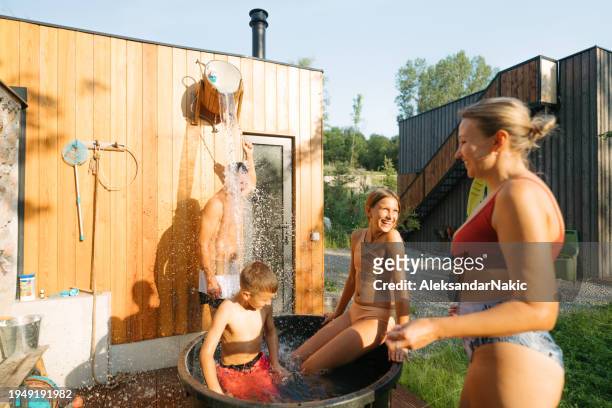 soothing after sauna soak - young boy in sauna stock pictures, royalty-free photos & images