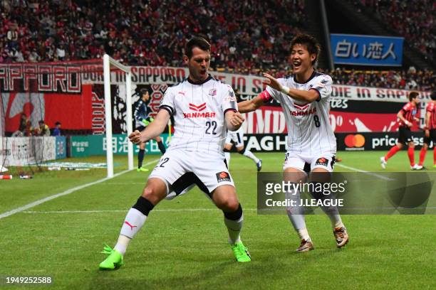 Matej Jonjic of Cerezo Osaka celebrates with teammate Yoichiro Kakitani after scoring the team's first goal during the J.League J1 match between...