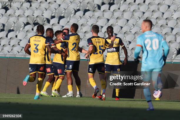 Christian Theoharous of the Mariners celebrates a goal with team mates during the A-League Men round 13 match between Central Coast Mariners and...