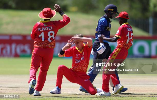 Kohl Eksteen of Zimbabwe celebrates the wicket of Sineth Jayawardene of Sri Lanka during the ICC U19 Men's Cricket World Cup South Africa 2024 match...