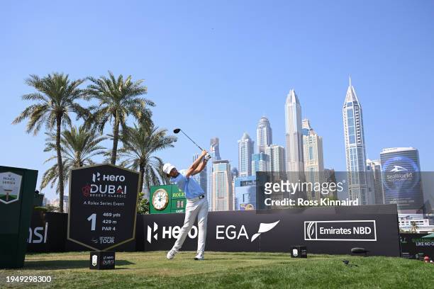 Tommy Fleetwood of England tees off on the first hole during the Final Round of the Hero Dubai Desert Classic at Emirates Golf Club on January 21,...