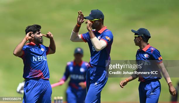 Tilak Bhandari of Nepal celebrates the wicket of Tom Jones of New Zealand during the ICC U19 Men's Cricket World Cup South Africa 2024 match between...