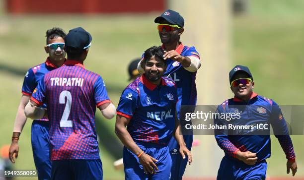 Tilak Bhandari of Nepal celebrates the wicket of Tom Jones of New Zealand during the ICC U19 Men's Cricket World Cup South Africa 2024 match between...