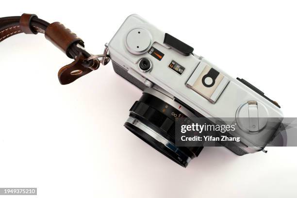 close-up view of old film camera cut out on white background - grey belt stock pictures, royalty-free photos & images