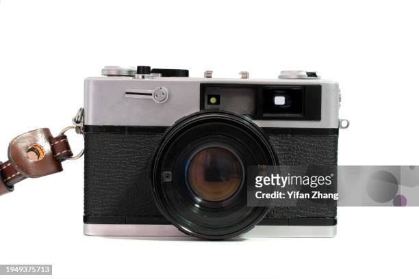 close-up view of old film camera cut out on white background - grey belt stock pictures, royalty-free photos & images