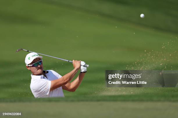 Haotong Li of China plays a bunker shot on the third hole during the Final Round of the Hero Dubai Desert Classic at Emirates Golf Club on January...