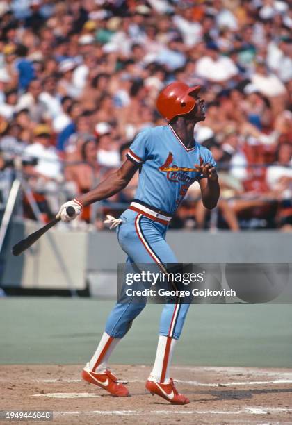 Willie McGee of the St. Louis Cardinals bats against the Pittsburgh Pirates during a Major League Baseball game at Three Rivers Stadium in 1982 in...