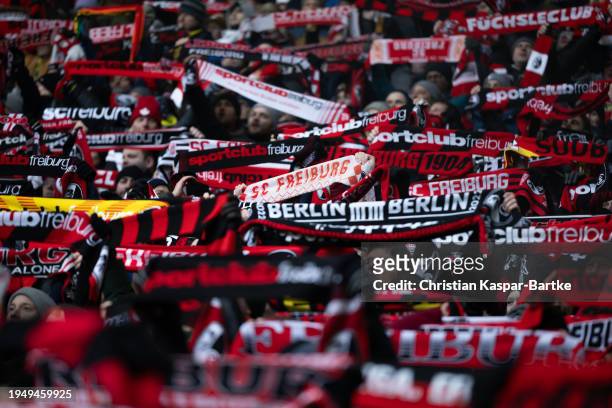 Fans of SC Freiburg hold their scarfs to show their support during the Bundesliga match between Sport-Club Freiburg and TSG Hoffenheim at Europa-Park...
