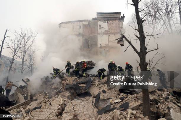 Rescuers search for people under the rubble at a residential building damaged in the Russian missile attack on Kharkiv. As reported, the Russian...