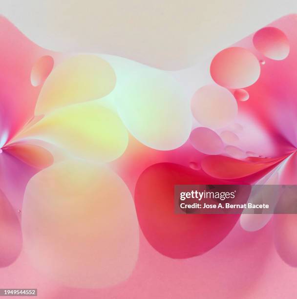 abstract background with floating pink and yellow liquid bubbles. - bernat bacete stock pictures, royalty-free photos & images