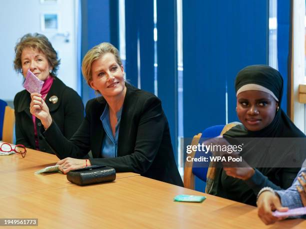 Sophie, Duchess of Edinburgh holds female hygiene products as she visits Harris Girls' Academy in East Dulwich on January 24, 2024 in London,...