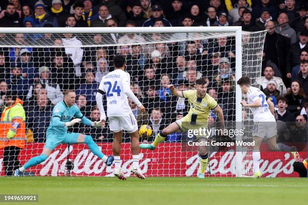 Daniel James of Leeds United scores his team's first goal under pressure from Andrew Hughes of Preston North End during the Sky Bet Championship...