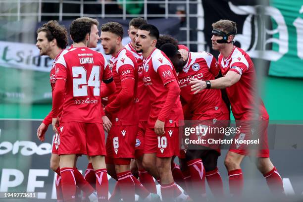 The team of Bielefeld celebrates the first goal during the 3. Liga match between Preußen Münster and Arminia Bielefeld at Preussenstadion on January...