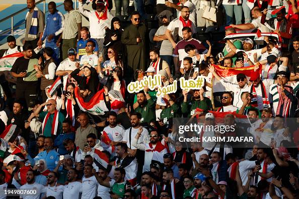 Iraq fans cheer during the Qatar 2023 AFC Asian Cup Group D football