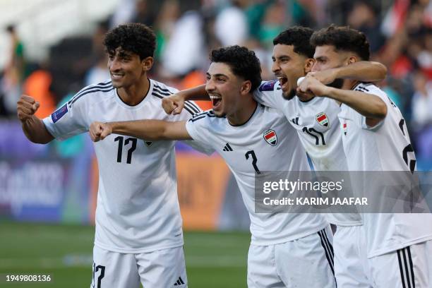 Iraq's players celebrate with their supporters after the Qatar 2023 AFC Asian Cup Group D football match between Iraq and Vietnam at the Jassim bin...