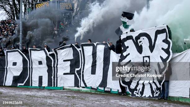 Fans of Muenster fire smokebombs during the 3. Liga match between Preußen Münster and Arminia Bielefeld at Preussenstadion on January 21, 2024 in...