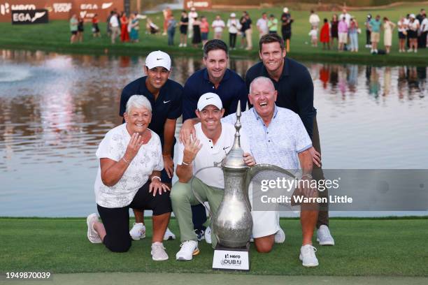 Rory McIlroy of Northern Ireland poses for a photo with his parents, Rosie and Gerry McIlroy, his caddie Harry Diamond, and his team after the Final...