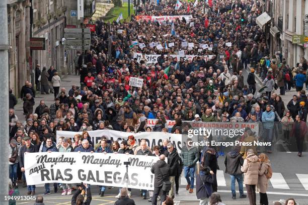 Hundreds of demonstrators during a protest against the management for the dumping of pellets, on 21 January, 2024 in Santiago de Compostela, A...