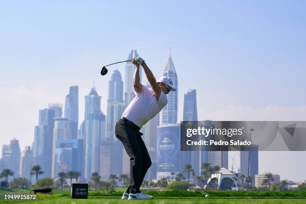 Haotong Li of China tees off on the 8th hole during the fourth round of the Hero Dubai Desert Classic on the Majlis Course at Emirates Golf Club on...
