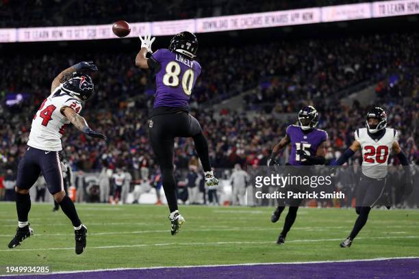 Tight end Isaiah Likely of the Baltimore Ravens catches a touchdown in front of cornerback Derek Stingley Jr. #24 of the Houston Texans during the...