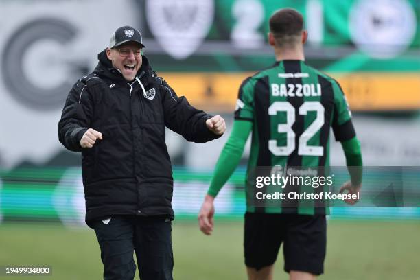 Head coach Sascha Hildmann of Muenster celebrates weith Luca Bazzoli of Muenster after winning 2-1 the 3. Liga match between Preußen Münster and...