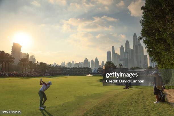 Rory McIlroy of Northern Ireland plays his second shot on the 18th hole during the final round of the Hero Dubai Desert Classic on The Majlis Course...