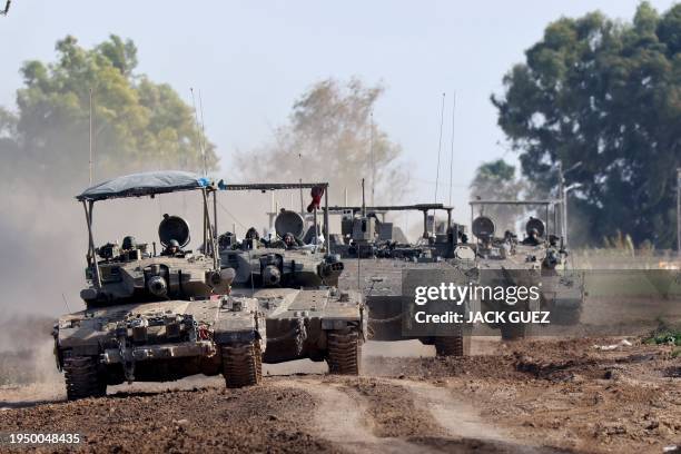 Israeli army tanks roll in southern Israel along the border with the Gaza Strip on January 24, 2024 amid ongoing battles between Israel and the...