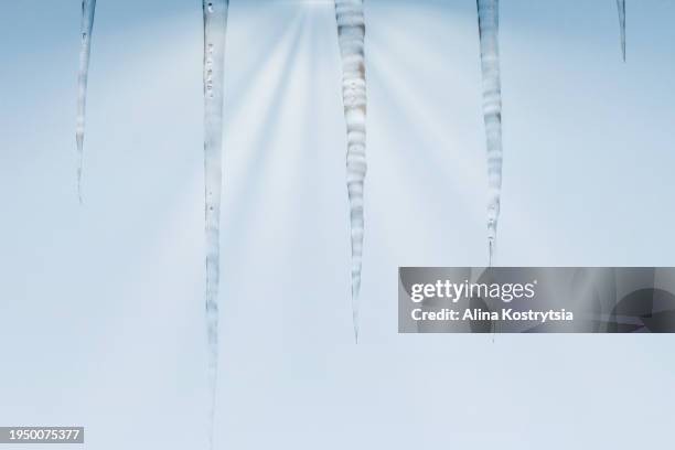 icicles hanging in front of sun's rays - shaking hangs stock pictures, royalty-free photos & images