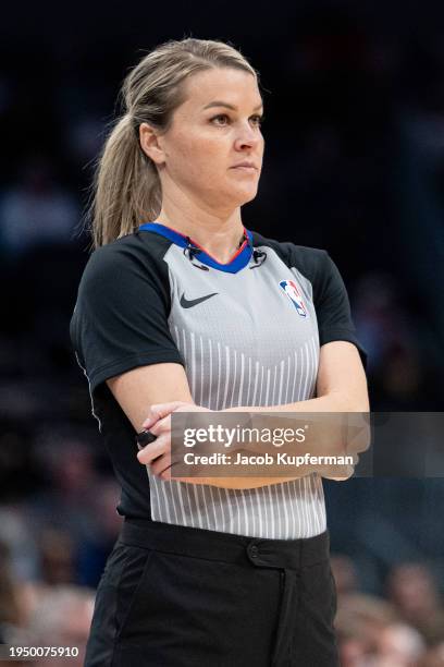 Referee Jenna Schroeder looks on during the game between the Charlotte Hornets and the Philadelphia 76ers at Spectrum Center on January 20, 2024 in...