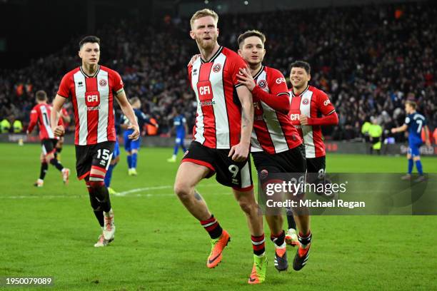 Oliver McBurnie of Sheffield United celebrates scoring his team's second goal from the penalty spot during the Premier League match between Sheffield...