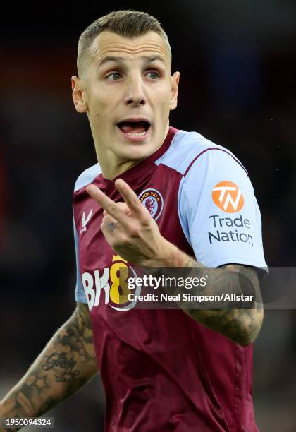 Lucas Digne of Aston Villa reacts during the Premier League match between Aston Villa and Arsenal FC at Villa Park on December 9, 2023 in Birmingham,...