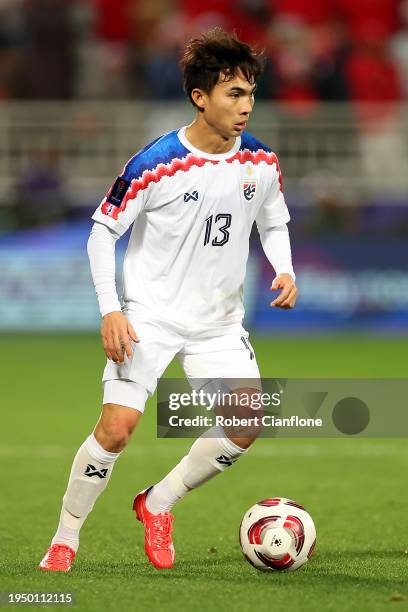 Rungrat Phumichantuk of Thailand runs with the ball during the AFC Asian Cup Group F match between Oman and Thailand at Abdullah Bin Khalifa Stadium...