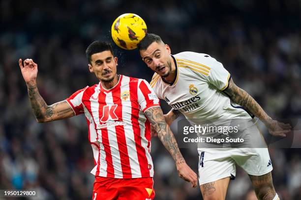 Joselu Mato of Real Madrid CF battles for the ball with Chumi of UD Almeria during the LaLiga EA Sports match between Real Madrid CF and UD Almeria...