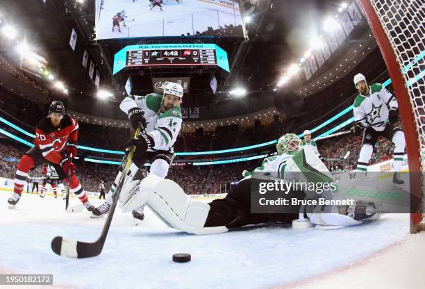 Scott Wedgewood of the Dallas Stars makes the first period save against the New Jersey Devils at Prudential Center on January 20, 2024 in Newark, New...