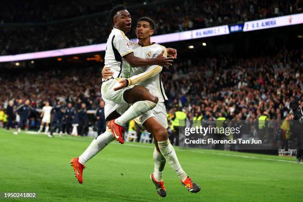 Vinicius Junior of Real Madrid celebrates with Jude Bellingham of Real Madrid after Daniel Carvajal of Real Madrid scores the teams third goal during...