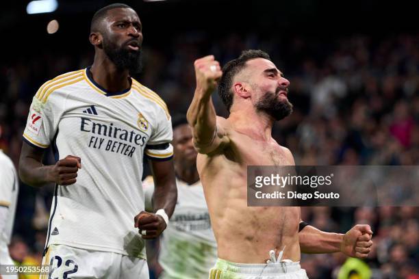 Daniel Carvajal of Real Madrid CF celebrates after scoring his team's third goal with teammate Antonio Rudiger during the LaLiga EA Sports match...