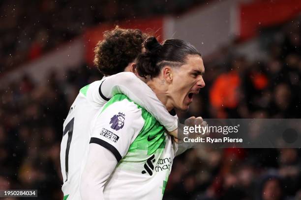 Darwin Nunez of Liverpool celebrates scoring his team's first goal with teammate Curtis Jones during the Premier League match between AFC Bournemouth...