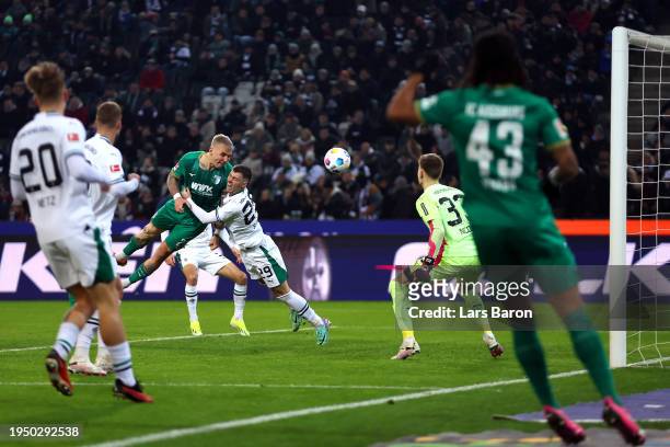 Philip Tietz of FC Augsburg scores his team's first goal during the Bundesliga match between Borussia Mönchengladbach and FC Augsburg at Borussia...