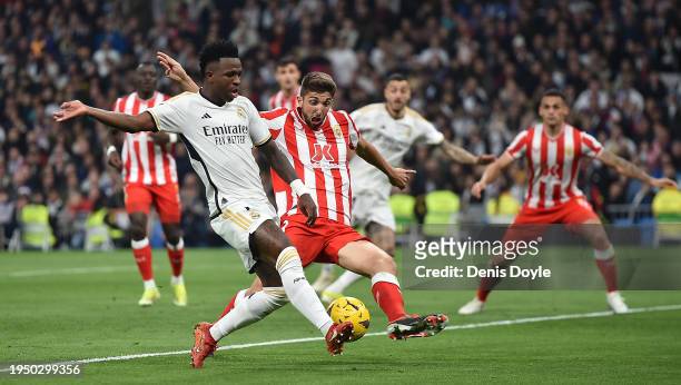 Vinicius Junior of Real Madrid shoots at goal while being challenged by Edgar Gonzalez of UD Almeria during the LaLiga EA Sports match between Real...