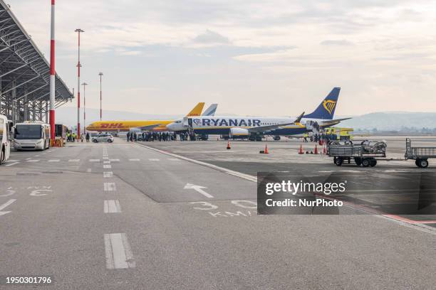 Passengers boarding a Boeing 737 MAX 8-200 passenger airplane of Ryanair low cost airline carrier at Thessaloniki Makedonia International Airport...